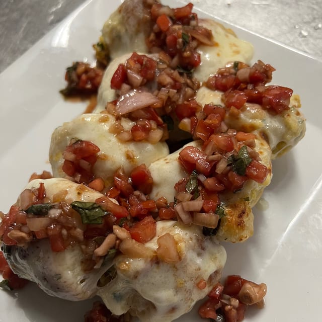 Cheesy garlic knots with bruschetta.